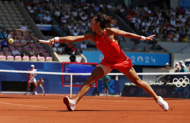 Zheng Qinwen of China competes during the women's singles semifinal of tennis against Iga Swiatek of Poland at the Paris Olympics on Aug. 1, 2024.