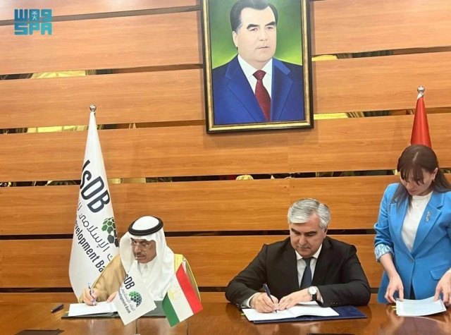 Islamic Development Bank (IsDB) Group President Dr. Mohammad Al-Jasser and Tajik Minister of Finance Fayzuddin Qahrizoda sign the agreement on Monday.