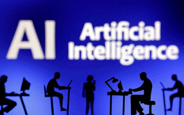 Figurines with computers and smartphones are seen in front of the words "Artificial Intelligence AI" in this illustration taken, February 19, 2024.