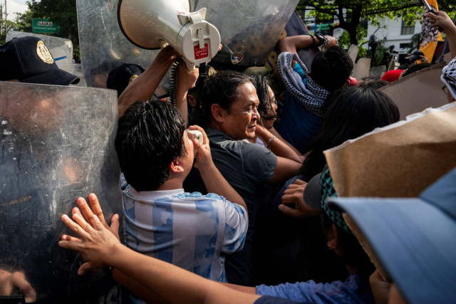 Police officers block Filipino activists from marching towards the US Embassy, during a protest in support of Palestinians, in Manila, Philippines, October 5, 2024.