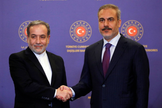 Turkish Foreign Minister Hakan Fidan shakes hands with his Iranian counterpart Abbas Araqchi during a joint press conference in Istanbul, Türkiye, October 19, 2024.