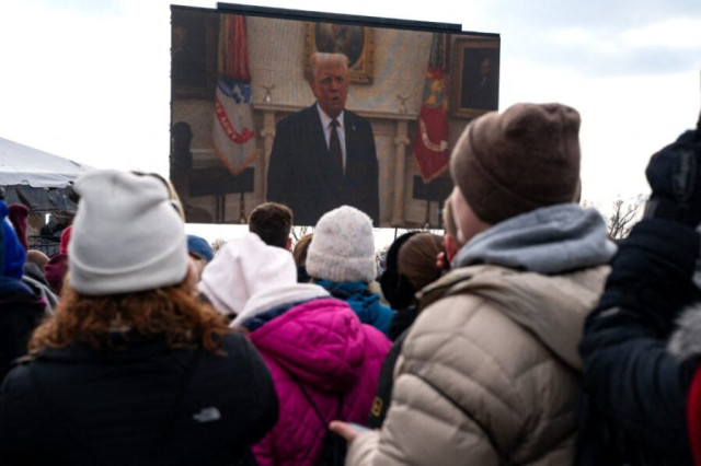 People attending the annual March for Life rally watch a pre-tapped video recording of US President Donald Trump on the National Mall on January 24, 2025 in Washington, DC. Anti-abortion activists attend the annual march that marked the anniversary of the