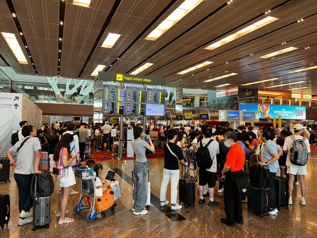 Passengers formed long queues at Singapore Airport due to major IT outage in Singapore on July 19, 2024