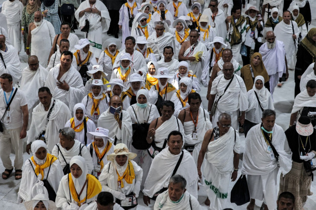 Arriving Muslim pilgrims walk at the Grand Mosque in Saudi Arabia's holy city of Mecca on June 4, 2024 ahead of the annual hajj pilgrimage.