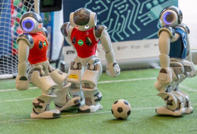 Nao robots of the Nomadz team, programmed by the ETHZ and Insait Bulgaria, play a game of soccer during the AI for Good Global summit on artificial intelligence, organised by the International Telecommunication Union (ITU), in Geneva, Switzerland, May 30,