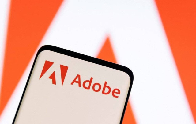 Adobe logo is seen on smartphone in this illustration taken June 13, 2022.