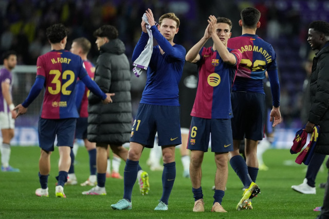 Barcelona's Dutch midfielder #21 Frenkie De Jong and Barcelona's Spanish midfielder #06 Pablo Gavi celebrate their victory at the end of the Spanish league football match between Real Valladolid FC and FC Barcelona at the Jose Zorrilla stadium in Valladol