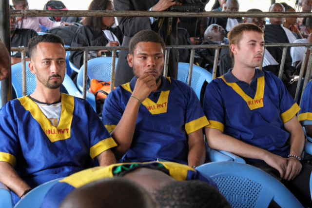 Benjamin Reuben Zalman-Polun, Marcel Malanga and Tyler Thompson, American citizens suspected along with a group of around 50 other people to be involved in an attempted coup in Congo, wait for the final verdict during their trial in Kinshasa, Congo, Sept.