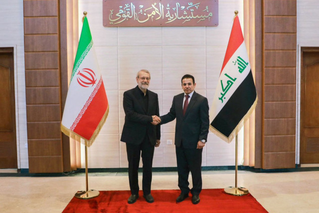 This handout picture released by Iraq's National Security Advisory shows National Security Advisor Qassim Alaraji meeting with Iran's head of the National Security Council Ali Larijani in Baghdad on August 11, 2025. Larijani is on a three-day tour, starti
