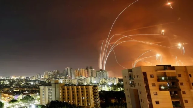 Streaks of light are seen as Israel's Iron Dome anti-missile system intercepts rockets launched from the Gaza Strip towards Israel, as seen from Ashkelon, Israel, May 12