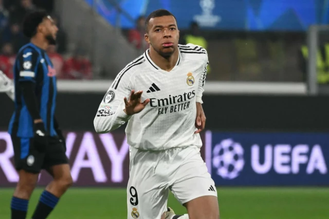 Real Madrid's French forward #09 Kylian Mbappe celebrates his team's first goal during the UEFA Champions League football match between Atalanta and Real Madrid at the Gewiss Stadium in Bergamo, on December 10, 2024.