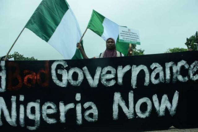 Photo of a Nigerian with Nigerian Flag