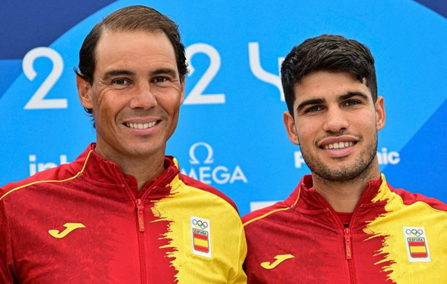 Spain's Rafael Nadal (L) and Spain's Carlos Alcaraz pose for pictures during a press conference at the Olympic Village, in Paris, on July 24, 2024, prior to take part in the men's singles tennis competition of the Paris 2024 Olympic Games