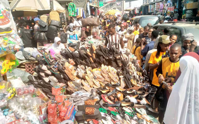 Traders displaying their wares on the road.