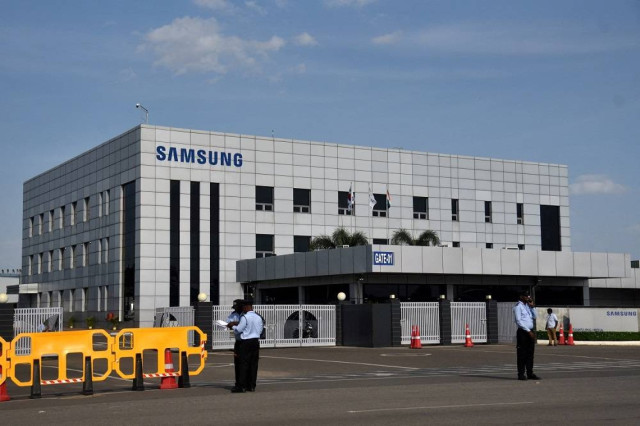 Security guards stand outside a Samsung facility during a strike by the factory workers demanding higher wages in Sriperumbudur, near the city of Chennai, India, September 16, 2024.