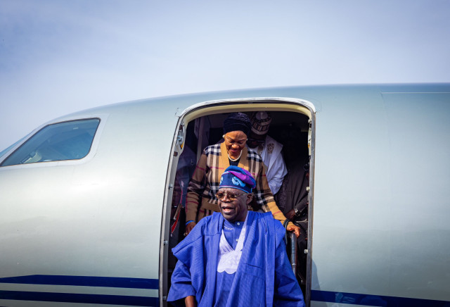 Tinubu disembarking from plane