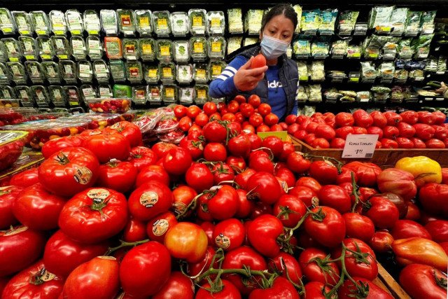 A person shops at a Whole Foods grocery store in the Manhattan borough of New York City, New York, US, March 10, 2022