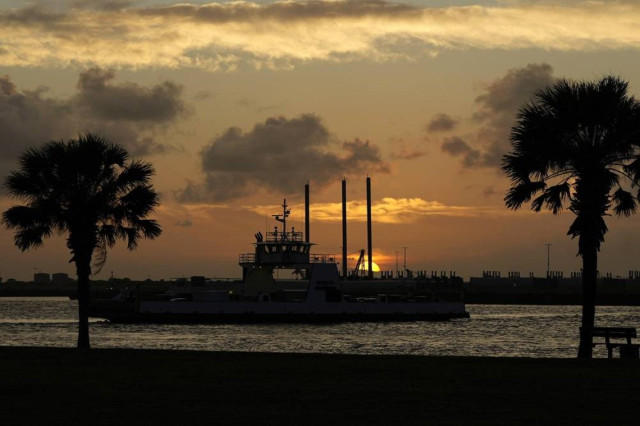 Vehicles are carried by ferry across Aransas Pass as Hurricane Beryl moves closer to the Texas coast, Saturday, July 6, 2024, in Port Aransas, Texas.