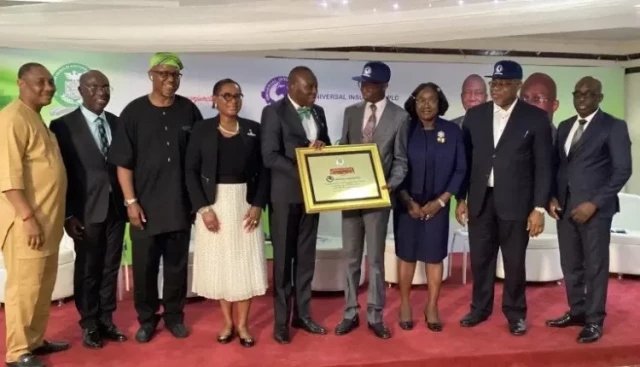 NCRIB President, Babatunde Oguntade (5th from left) present plaque to MD/CEO of Universal Insurance Plc Mr Benedict Ugochukwu Ujoatuonu ( 4th from right) at the event