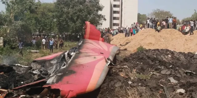Wreckage of Air India Flight 171 near BJ Medical College, where hundreds gathered after the crash.