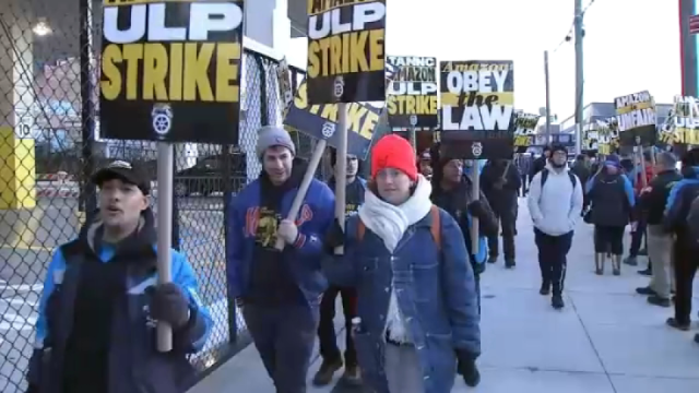 Photo of Amazon workers walk off the job