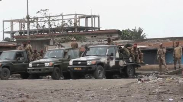 AP
State security forces are seen outside Makala prison in Kinshasa, Democratic Republic of the Congo, following the attempted jailbreak