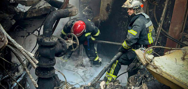 Ukrainian Firefighters at the scene of the incident
