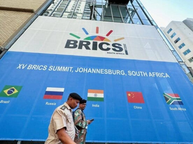 People walk past the Sandton Convention Center, which hosted the BRICS Summit, in Johannesburg, South Africa August 19, 2023.