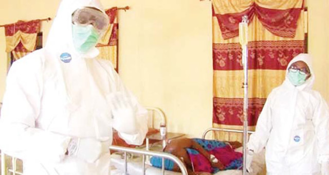 Doctors treating a Lassa Fever patient