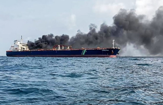 handout photo taken and released by Malaysian Maritime Enforcement Agency on July 19, 2024 shows the Singapore-flagged tanker Hafnia Nile on fire in Tanjung Sedili, near Singapore.