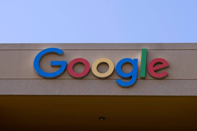 The Google sign is shown on one of the company's office buildings in Irvine, California, US, October 20,