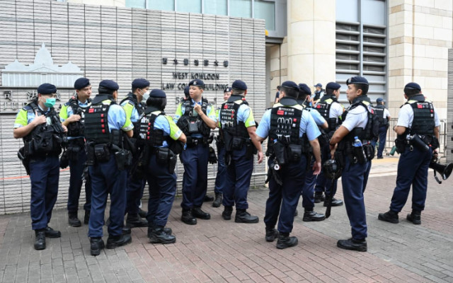 Photo of Hong Kong Security Officers during the trial of 14 Pro-democracy Activists
