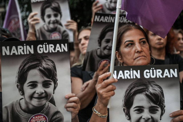 Protesters hold portraits of eight-year-old Narin Guran, whose body was found after being missing for 19 days, during a protest at Kadikoy district in Istanbul, on September 8,2024