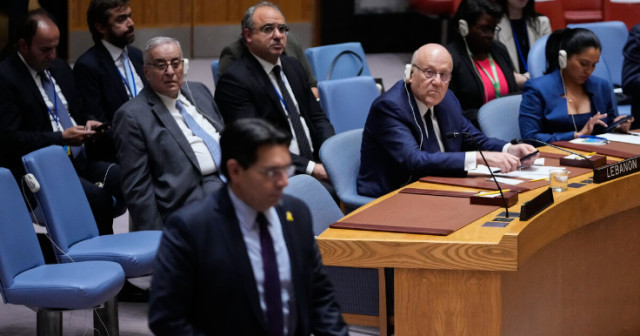 Photo of Lebanese Prime Minister Najib Mikati, and his delegation watch Israel’s ambassador to the United Nations, Danny Danon as he arrives during a meeting of the Security Council