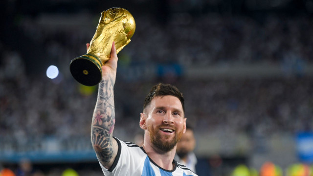 Lionel Messi parades the World Cup trophy