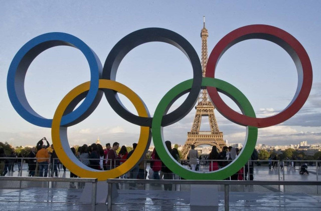 Olympic rings are set up at Trocadero plaza that overlooks the Eiffel Tower, a day after the official announcement that the 2024 Summer Olympic Games will be in the French capital, in Paris, France, Thursday, Sept. 14, 2017