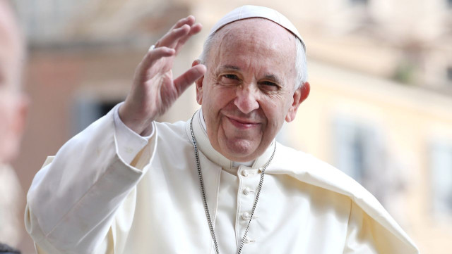 Pope Francis delivers the Sunday Angelus prayer overlooking St. Peter' Square at the Vatican, on July 18.