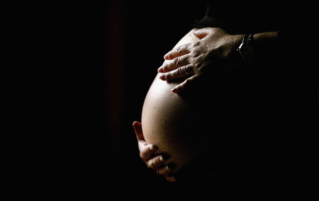 A photo illustration of a pregnant woman