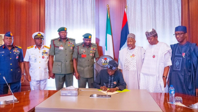 Photo of President Bola Tinubu and Military personnel